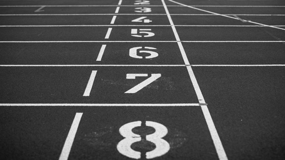 Track Numbers Painted on a Track & Field - Black & White Photo